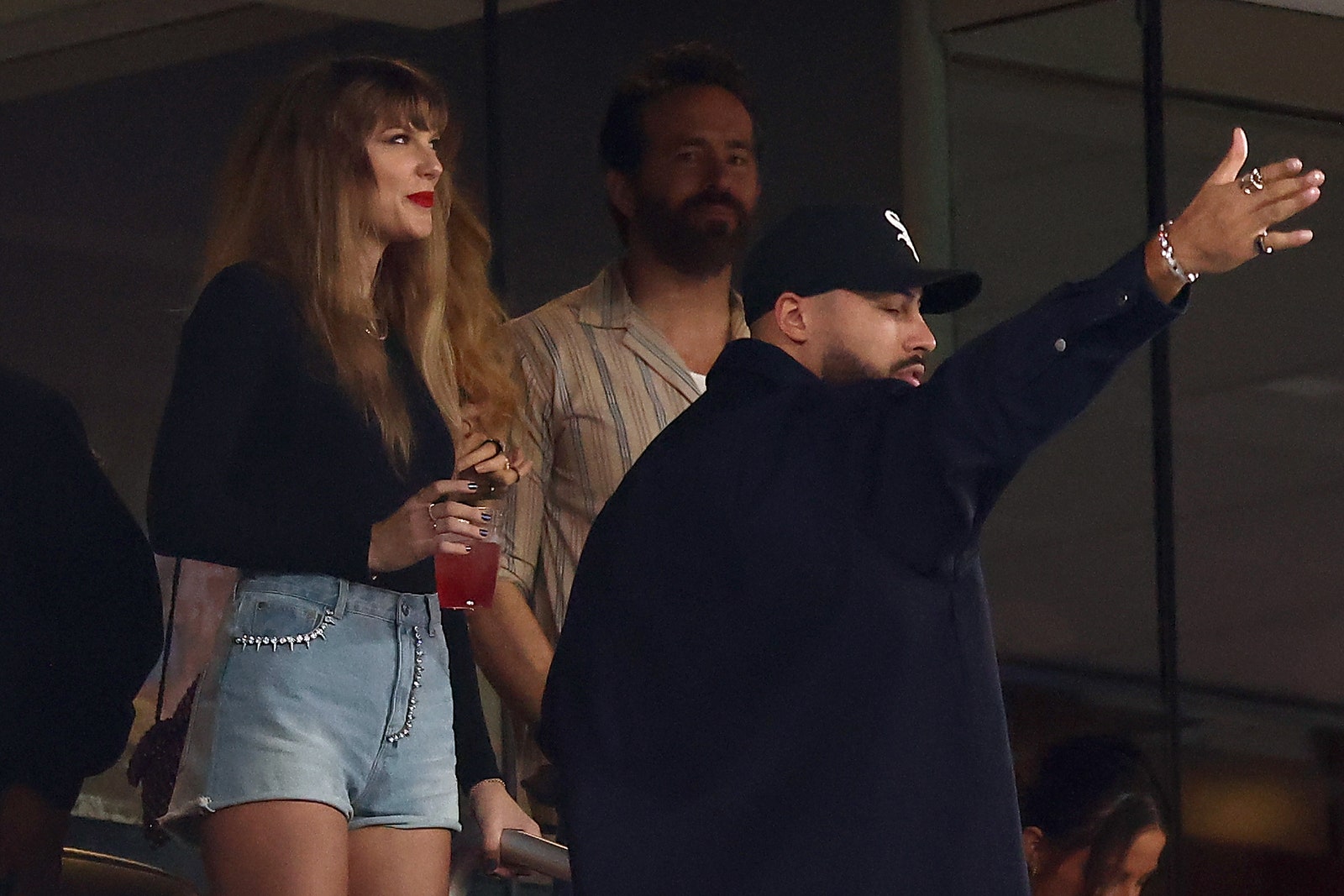 EAST RUTHERFORD NEW JERSEY  OCTOBER 01  Singer Taylor Swift and Actor Ryan Reynolds look on prior to the game between...